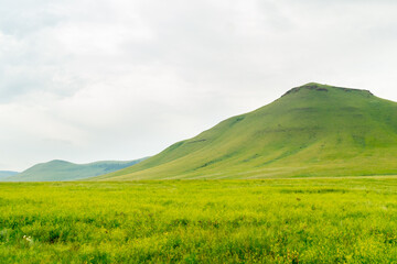 Beautiful steppe landscape: meadow, hills and sky. Khakassia, Russia.