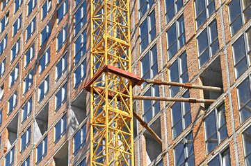 Crane and highrise construction site