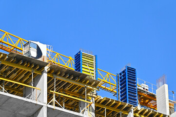 Crane and highrise construction site