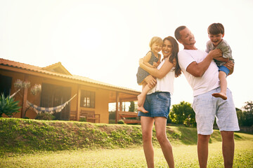 Family is the greatest blessing you can ever have. Shot of a happy family bonding together outdoors.