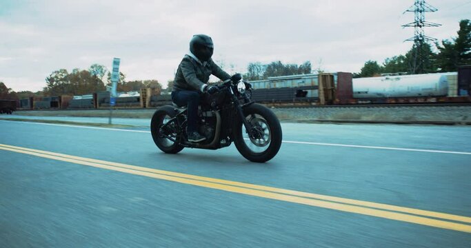 Motorcycle Driving Near Train Yard in Slow Motion 4K