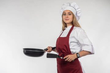 Chef with frying pan. Confident woman cook. Teenager girl in cook clothes. Cooking courses concept....
