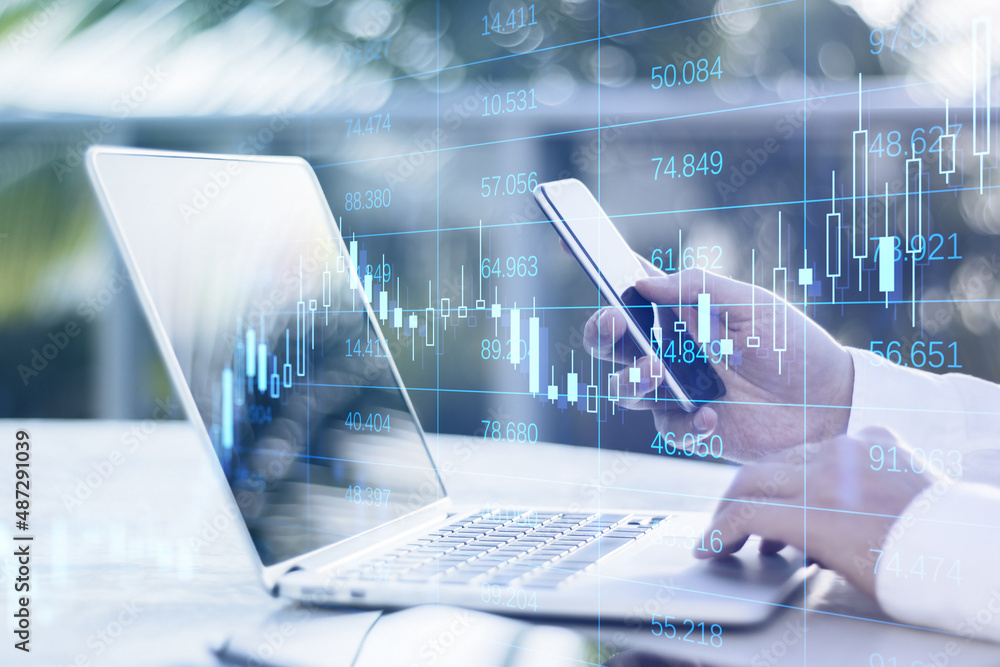 Poster Close up of businessman hands using laptop and smartphone with forex chart grid big data hologram on blurry background. Finance and technology concept. Double exposure.