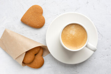 A cup of espresso on a gray background.