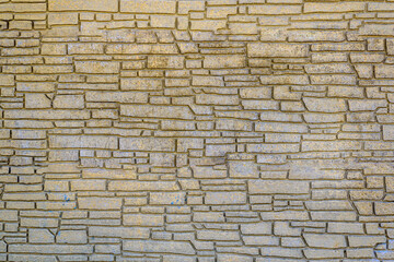 Texture of a decorative element in a concrete fence