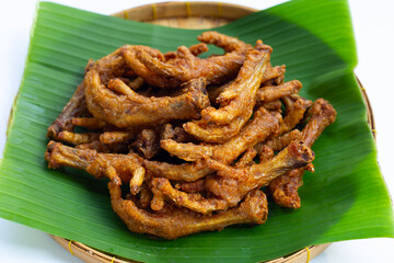 Fried chicken feet in bamboo basket