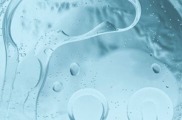The surface of the water. An image of a drop of oil on water. Background for the design.