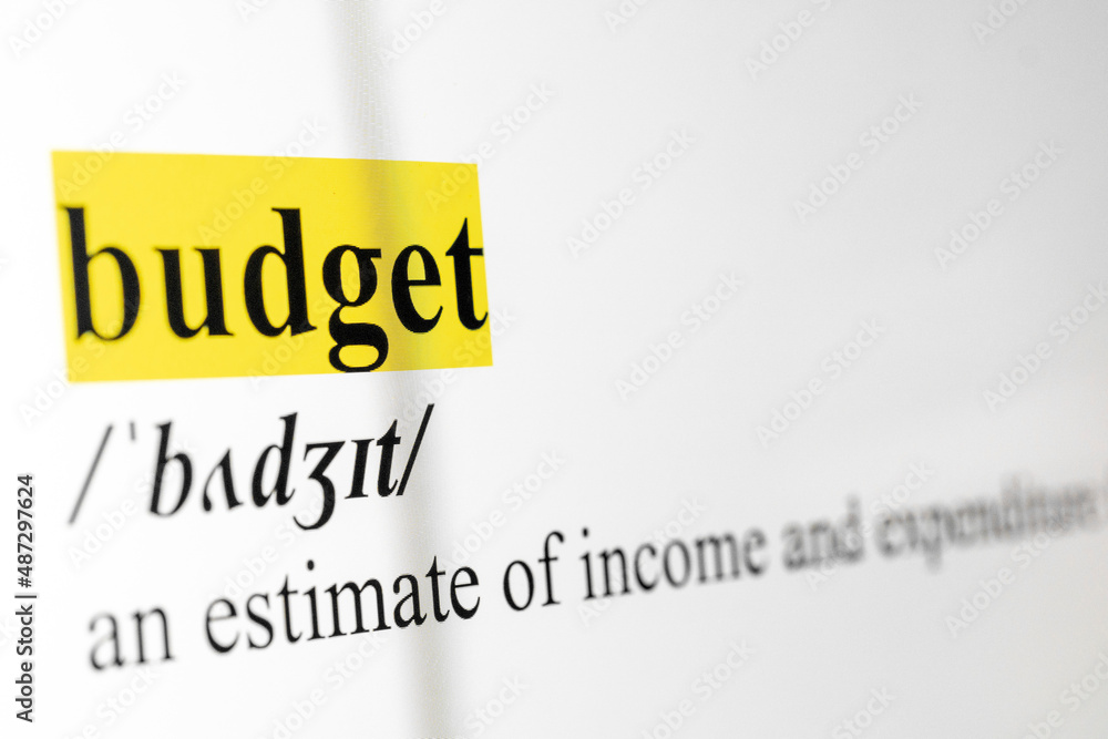 Poster budget text macro shot highlighted in yellow color on computer screen