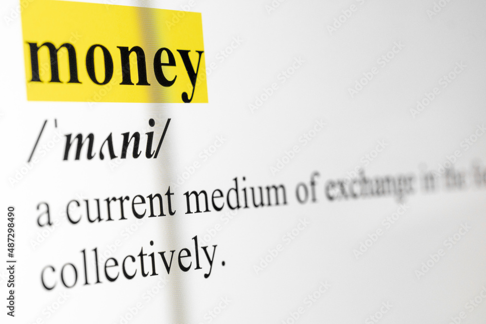 Poster money text macro shot highlighted in yellow color on computer screen