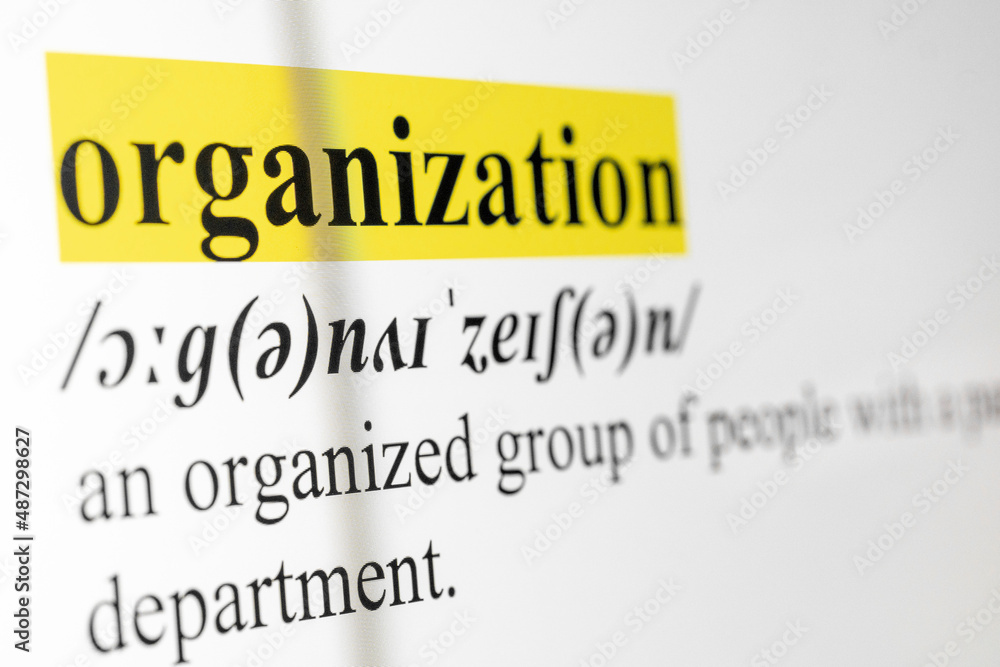 Poster organization text macro shot highlighted in yellow color on computer screen