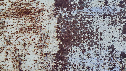 Texture of old metal wall with cracked paint and rust