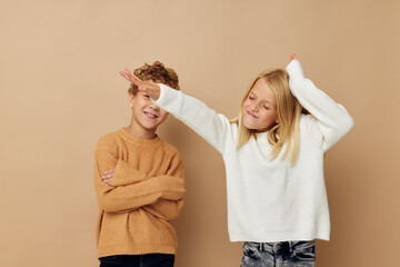 Photo of two children gesticulate with their hands together Lifestyle unaltered