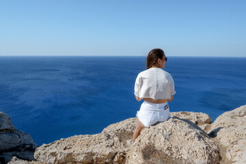 A cow girl by the sea