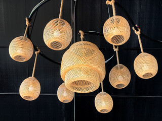 Hanging lantern lamps in wooden wicker made from bamboo. 