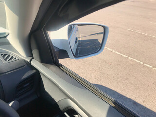Side rear-view mirror on a car. 