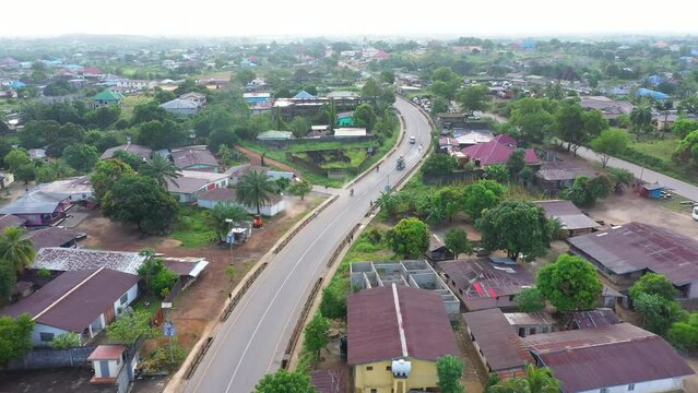 Aerial urban street follow traffic Bo Sierra Leone Africa. Sierra Leone on  coast of west Africa suffers extreme poverty and hunger. Tropical climate forest, jungle, mountain