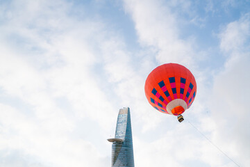 aerial view of colorful hot air balloons flying over Ho Chi Minh city, Vietnam