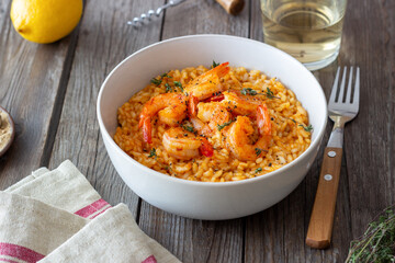 Risotto with shrimps, tomatoes and thyme. Italian food.