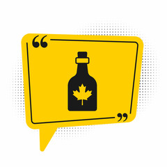 Black Bottle of maple syrup icon isolated on white background. Yellow speech bubble symbol. Vector