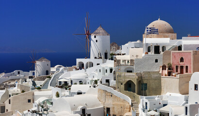 Fototapeta na wymiar Thira on the island of Santorini is a volcanic island in the Aegean Sea, which is part of the Cyclades archipelago.Multi-coloured abstrakt architecture on island.