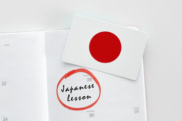 calendar planner notebook with date inscription japanese lesson marked and circled with marker, education foreign languages concept