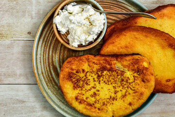 French toast  and white cheese. Rustic breakfast  made from deep fried   bread   with organic free range   eggs