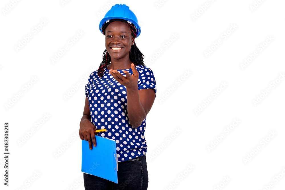 Wall mural young female engineer holding clipboard smiling.