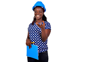 young female engineer holding clipboard smiling.