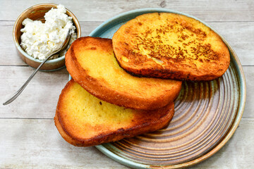 French toast  and white cheese. Rustic breakfast  made from deep fried   bread   with organic free range   eggs