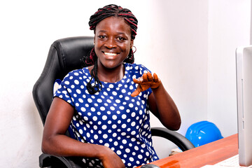 portrait of a beautiful businesswoman gesturing, smiling.