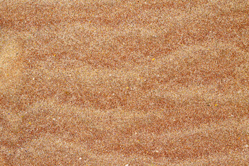 Pink sand texture. Coral pink sand beach background