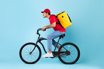 Courier Guy Riding Bike Delivering Meal, Blue Background, Side View