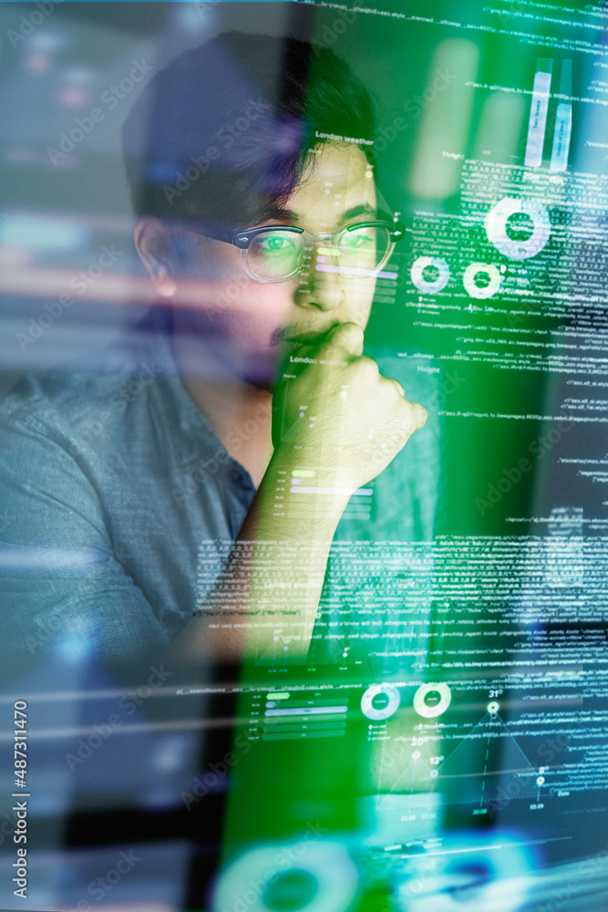 Poster Putting a lot of thought into his code. Cropped shot of a young computer programmer looking through data.