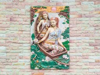 a beautifully designed wall with two women in the hightlight