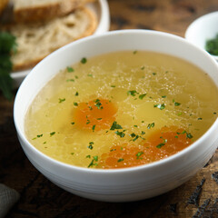 Traditional homemade chicken broth with vegetables