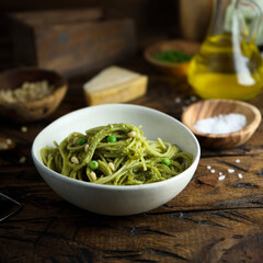 Spaghetti with pesto sauce and green pea