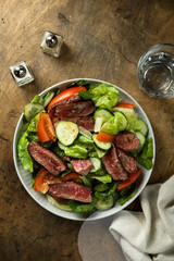 Fresh vegetable salad with beef steak