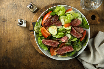 Fresh vegetable salad with beef steak