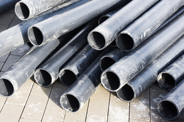 Pvc pipe background. Plastic pipes stacked. Underground construction site. Sanitary drain repair....