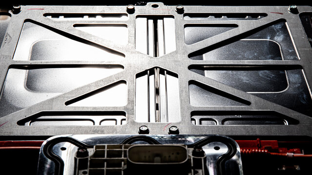 The battery modules of an electric vehicle are tightened with a steel subframe to achieve high rates of rigidity and structural strength. EV safety concept.