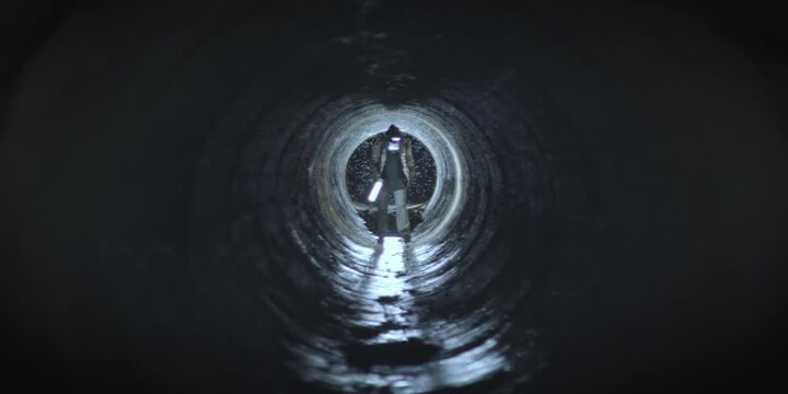 Woman with gas mask in a tunnel post apocalypse Nuclear zone. Cinematic concept. RED camera