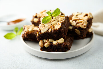 Traditional homemade brownies with caramel and peanut