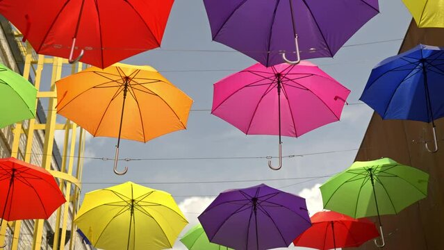 Colorful umbrellas suspended in the air.