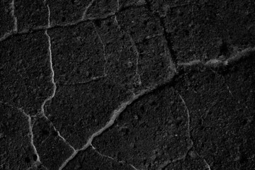 asphalt in cracks texture / abstract background cracks on asphalt road