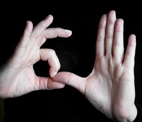 Woman's hands with black background