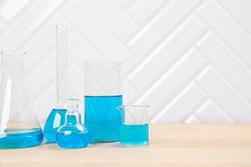 Laboratory glassware with test tubes. flasks, dropper, petri dishes, measuring cups and cylinders for scientific laboratories, laboratory equipment and analysis