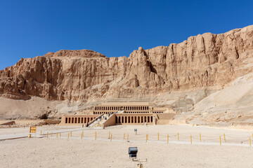 Mysterious Hatshepsut Temple on the blue sky background.