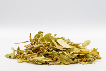 Winter herbal tea on a white background. Winter tea. Medicinal tea prepared from linden leaves, Clove particles and Chamomile