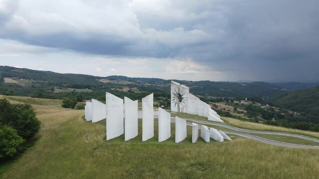 Aerial View of Kadinjaca WWII Memorial Complex on Hill in Green Landscape Above Uzice City, Serbia, Drone Shot