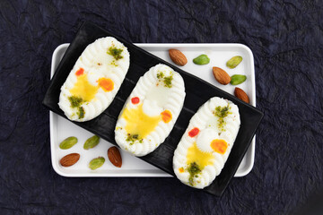 Indian Mithai Cham Cham Also Called Rasgulla Chomchom Or Rosogolla Chamcham Is Made Of Milk, Mawa, Khoya, Pista, Kesar, Khova, Paneer, Chenna, Chhena, Malai Dry Fruits Stuffings And Dunked In Chasni